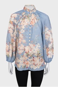 Light blue blouse with a tag