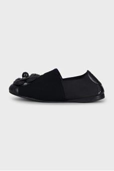 Black ballet flats decorated with a flower