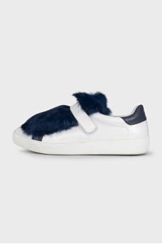 Leather sneakers decorated with blue fur