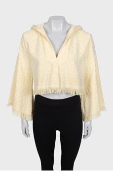 Cropped hoodie decorated with fringe