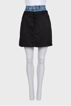 Black skirt with a jeans belt and tag