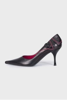 Black leather shoes with a button