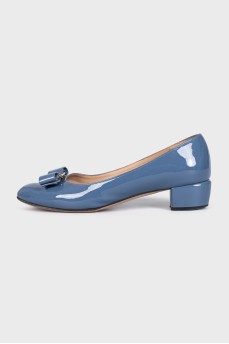Blue patent leather shoes with a bow