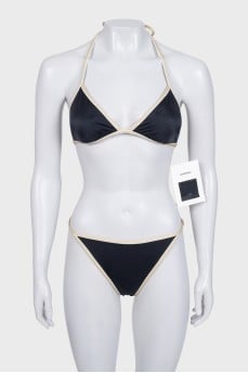 Black swimsuit with branded logo and tag