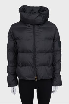 Black jacket with a hood and a brand logo