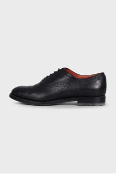 Leather brogues decorated with perforations