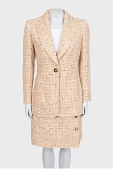 Beige tweed suit with a checkered print skirt