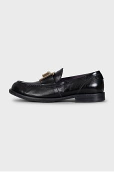 Men's loafers with a metal logo