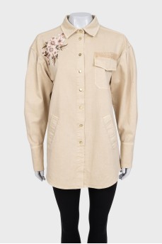Denim shirt with a flower patch