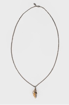 Bicolor pendant in the shape of an Aries head