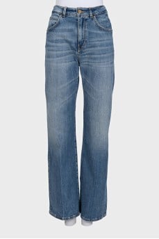 Flared jeans with a distressed effect