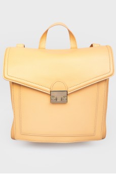 Rectangular leather backpack with tag