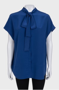 Sleeveless silk blouse with buttons