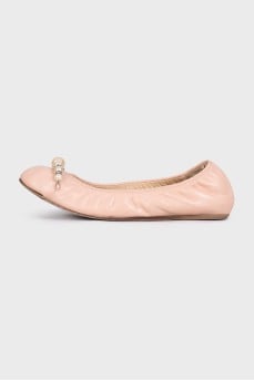 Pink leather ballet flats with decoration
