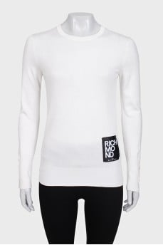 White jumper with gold decor on the sleeves