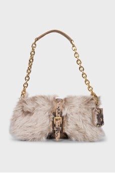 Leather bag decorated with fur