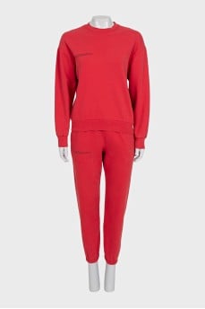 Red sweatshirt and tapered trousers suit