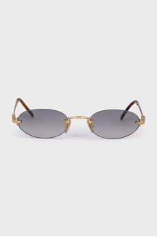 Oval sunglasses with gold hardware