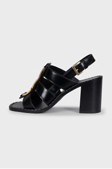 Black heeled sandals with gold hardware