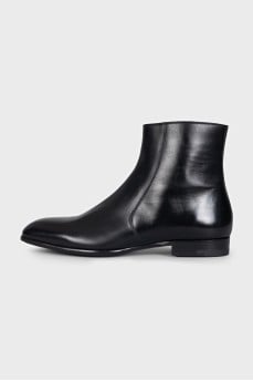 Black leather boots with a zipper