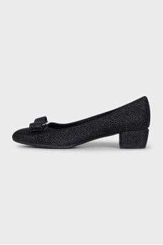 Black suede shoes with a bow