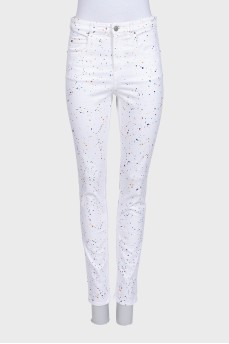 White jeans with a small multi-colored print