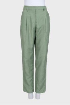 Green trousers with an arrow