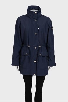 Blue windbreaker with a zipper and buttons
