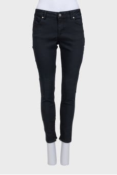 Black jeans with zippers on the legs