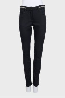 Black jeans with silver trim on the waistband