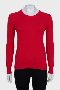 Red jumper with patches on the sleeves