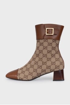 Brown ankle boots with a signature print