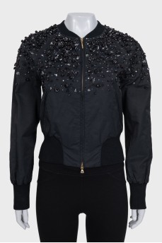 Cropped jacket decorated with beads