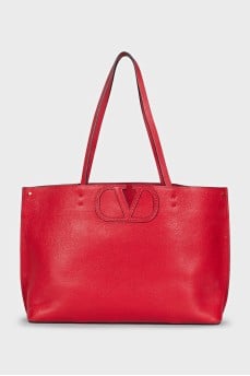 Red leather tote bag with logo