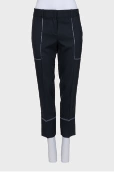 Black trousers with white stitching