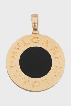 Round pendant made of gold and steel