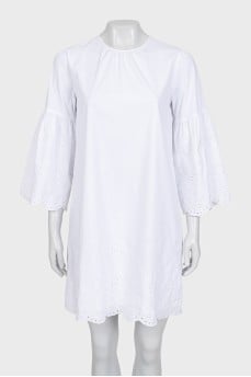 White dress with wide sleeves and perforations