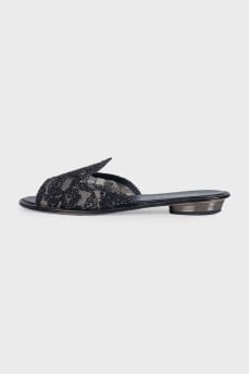 Black flip-flops decorated with rhinestones