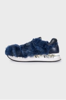 Blue sneakers decorated with fur