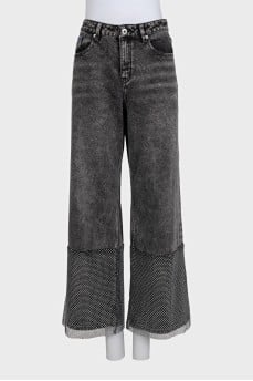 Black jeans decorated with rhinestones