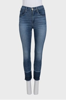 Blue jeans with fringe on the legs