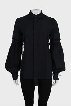 Black shirt with ties on the sleeves
