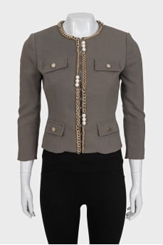 Green jacket with a gold chain