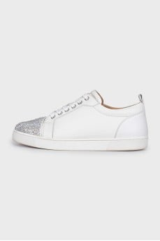 White sneakers decorated with rhinestones
