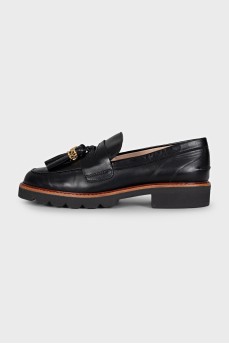Black leather loafers with decor