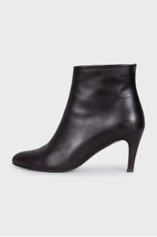 Black leather ankle boots with a zipper