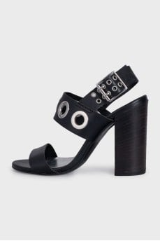 Leather sandals with heels decorated with eyelets
