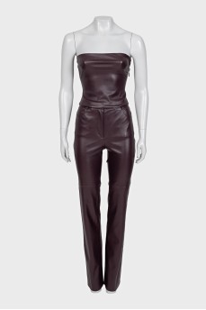 A suit consisting of a crop top and straight-leg trousers