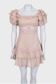 Fitted dress decorated with lace and frills