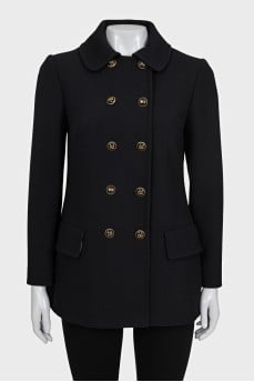 Double-breasted coat with gold buttons.